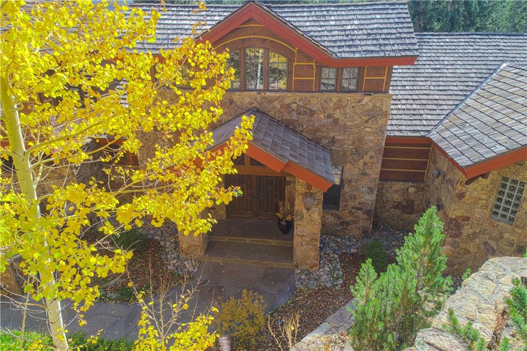 1065 4 O Clock Road Breckenridge, CO 80424 - Photo 31 of 35 a front view of a house with a yard