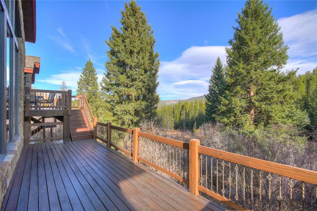 1065 4 O Clock Road Breckenridge, CO 80424 - Photo 33 of 35 a view of a balcony with wooden floor and outdoor seating