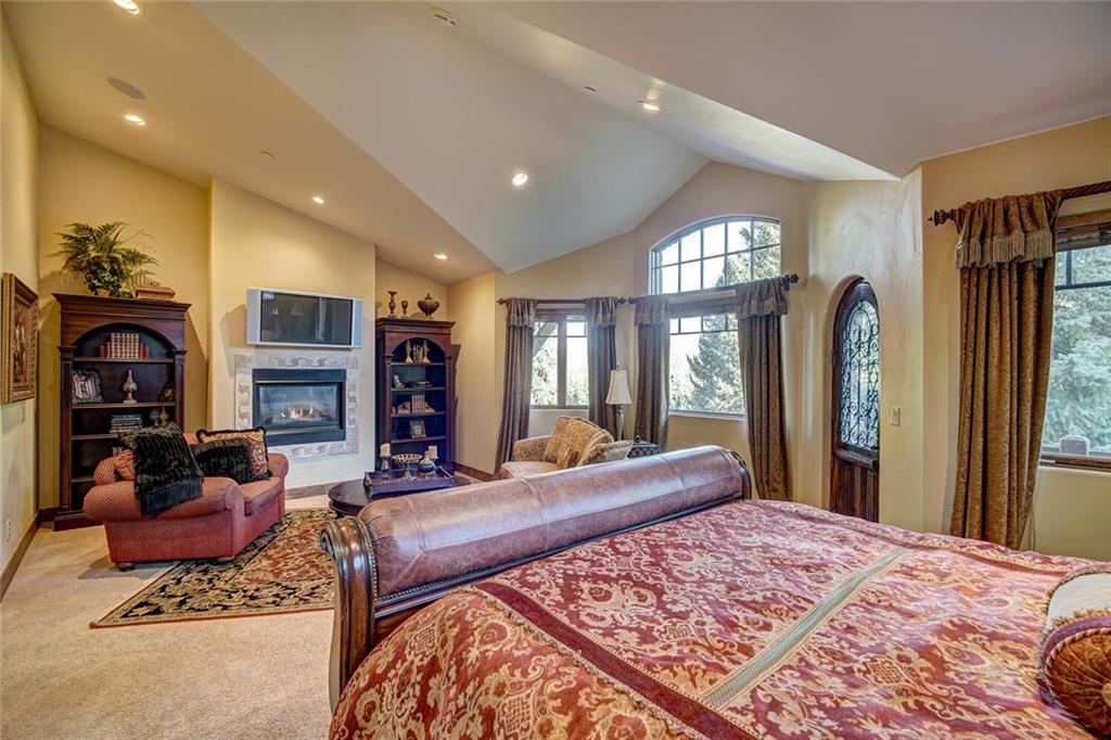 1065 4 O Clock Road Breckenridge, CO 80424 - Photo 6 of 35 a bed room with a bed and dresser