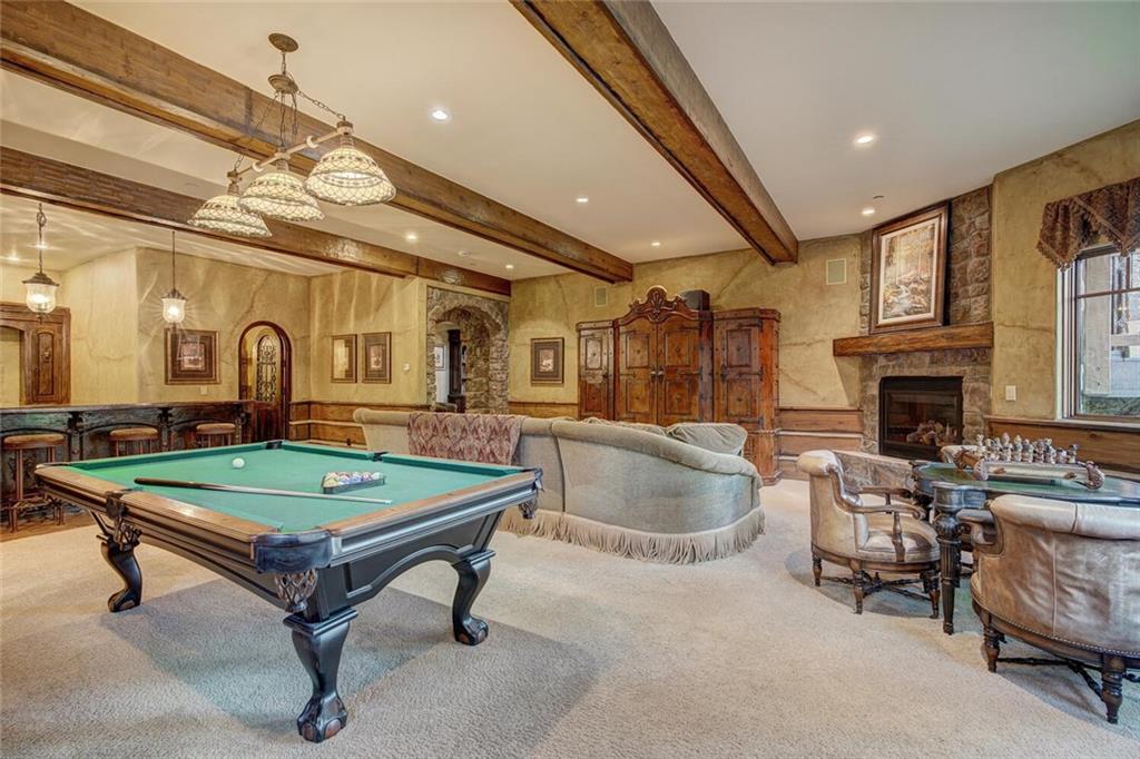 1065 4 O Clock Road Breckenridge, CO 80424 - Photo 7 of 35 a room with furniture a pool table and a fireplace