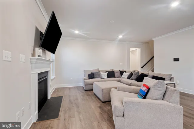 a living room with furniture fireplace and flat screen tv