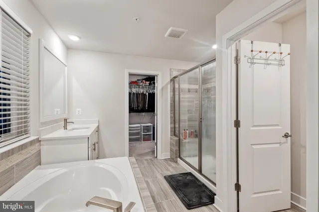 a room with a bed and a view of bathroom