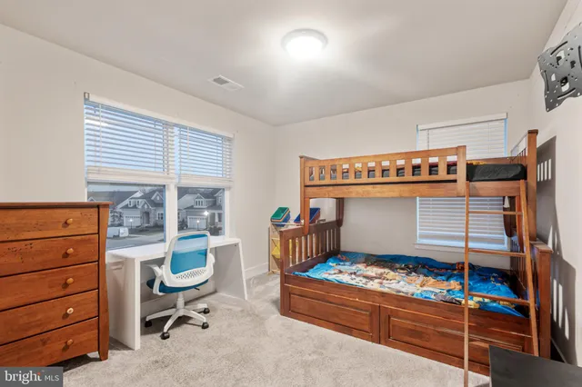 a room with furniture a rug and a window