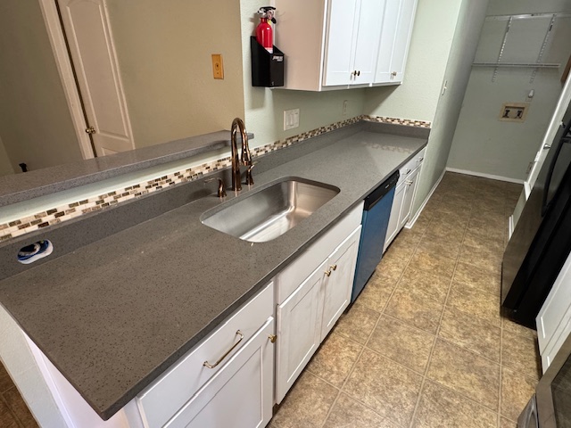 3603 Buffalo Springs Trail, Unit B Georgetown, TX 78628 - Photo 16 of 16 a kitchen with granite countertop a sink and a stove