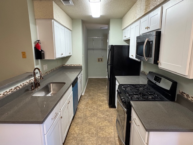 3603 Buffalo Springs Trail, Unit B Georgetown, TX 78628 - Photo 2 of 16 a kitchen with stainless steel appliances granite countertop a sink stove and refrigerator