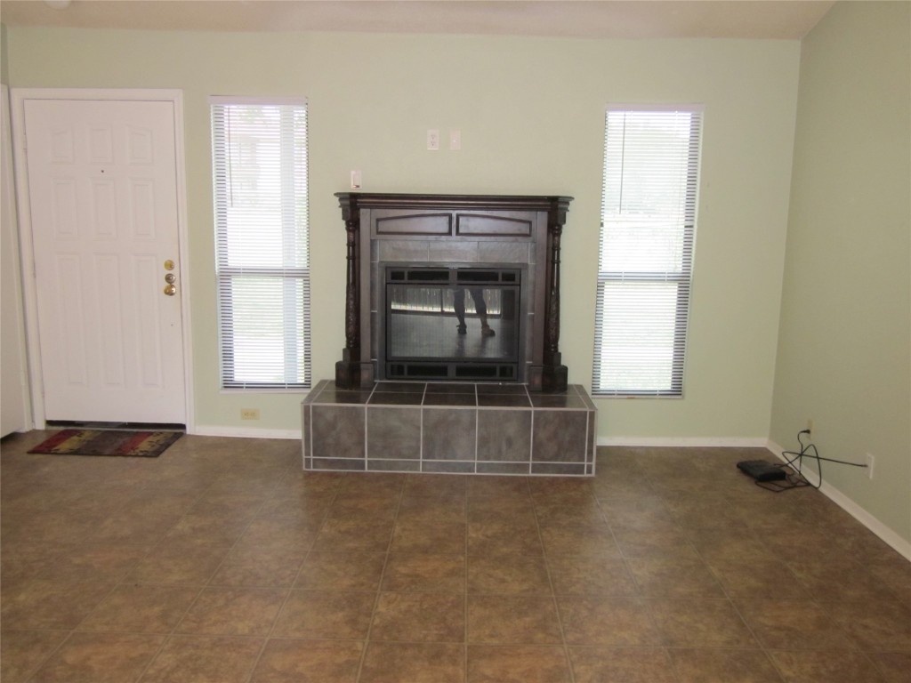 3603 Buffalo Springs Trail, Unit B Georgetown, TX 78628 - Photo 7 of 16 an empty room with wooden floor and windows