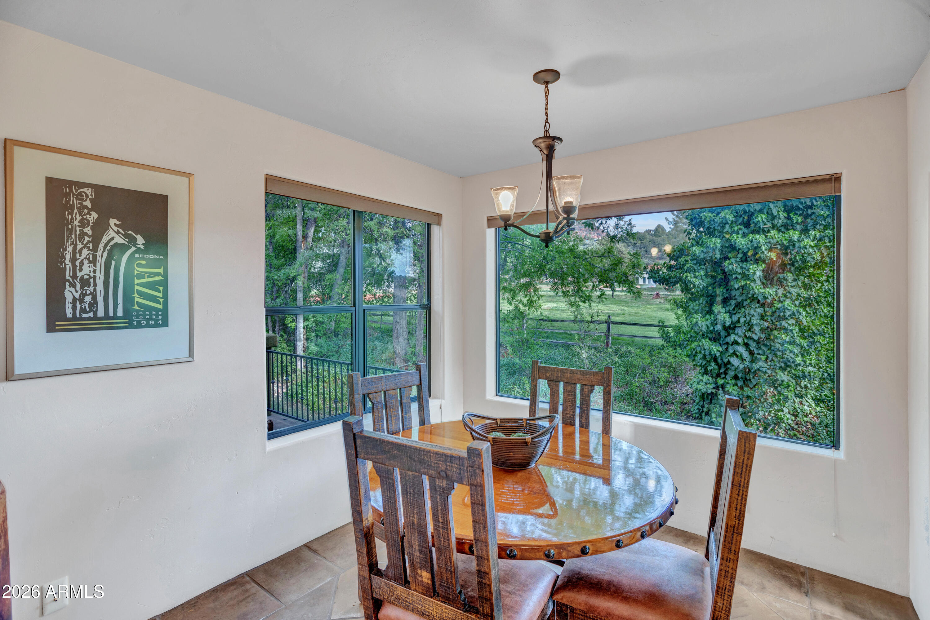 55 Ranch House Circle Sedona, AZ 86336 - Photo 18 of 61 a view of a dining room with furniture window and outside view