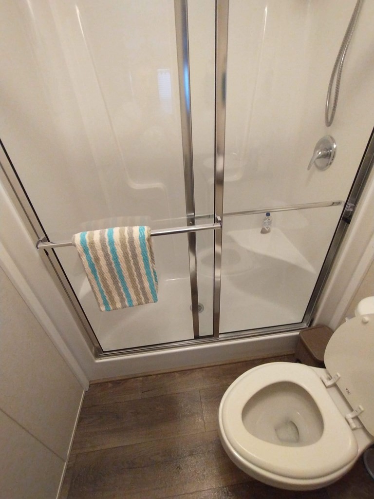 2438 Ridge Road Pigeon Forge, TN 37863 - Photo 26 of 37 a bathroom with a toilet and a window