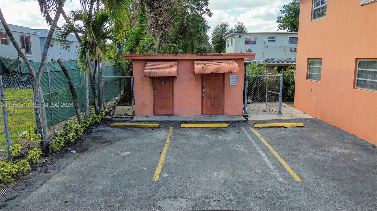 1716 Northwest 19th Street Miami, FL 33125 - Photo 13 of 20 front view of a house with a yard