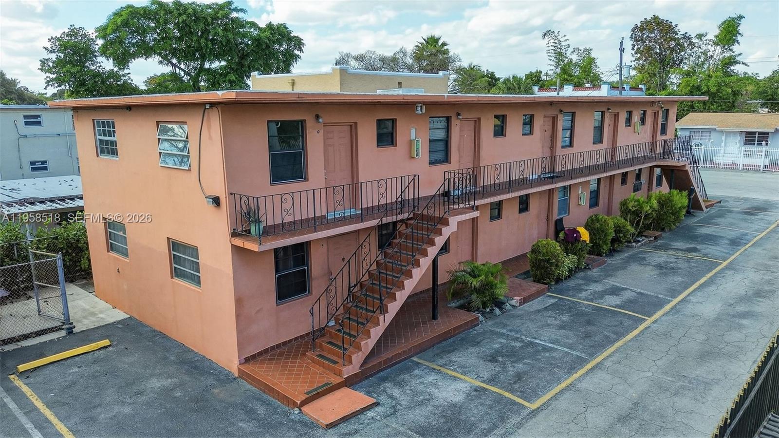 1716 Northwest 19th Street Miami, FL 33125 - Photo 3 of 20 a view of a house with wooden deck