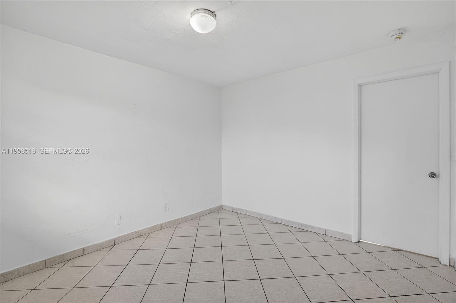 1716 Northwest 19th Street Miami, FL 33125 - Photo 5 of 20 a view of an empty room
