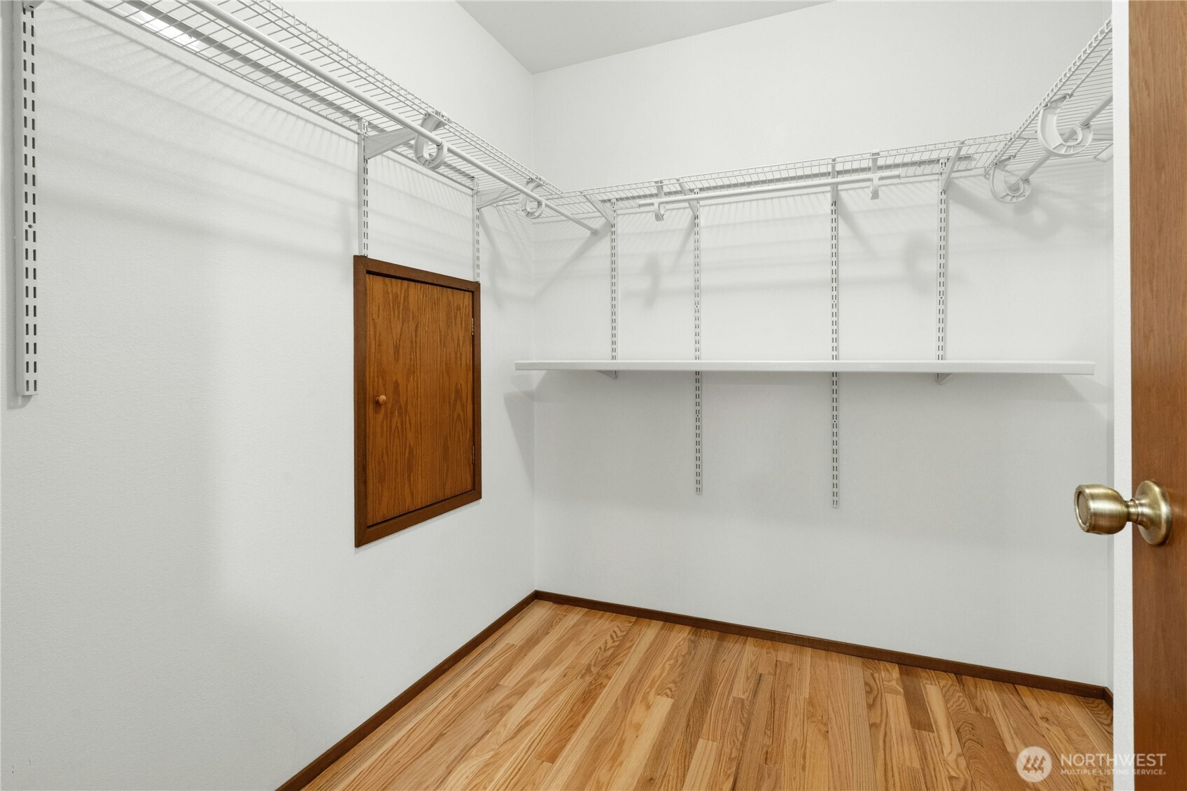5211 103rd Street Southwest, Unit SW Mukilteo, WA 98275 - Photo 23 of 40 a view of a room with wooden floor and small window
