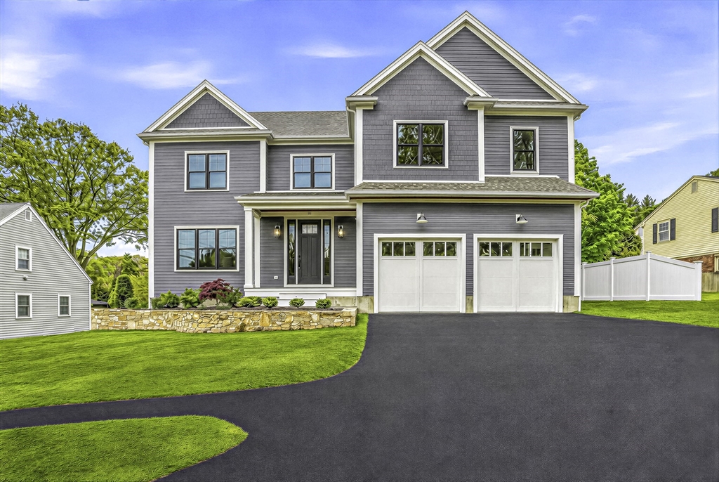 18 Avon Circle Needham, MA 02494 - Photo 1 of 18 a front view of a house with a yard and trees