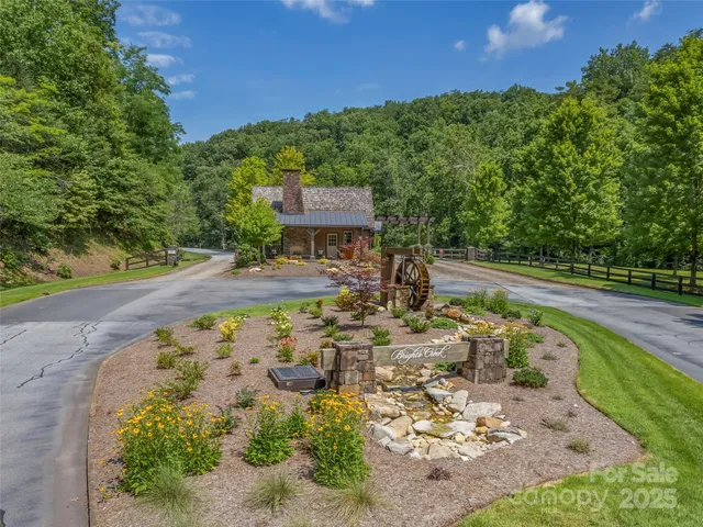 an aerial view of a house with a yard basket ball court and outdoor seating