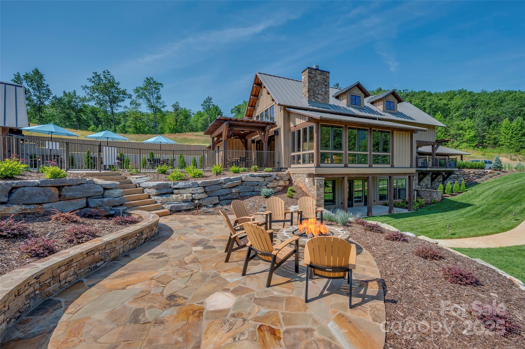 0 Deep Gap Rd Mill Spring East, Unit 97 Mill Spring, NC 28756 - Photo 18 of 22 a front view of a house with garden
