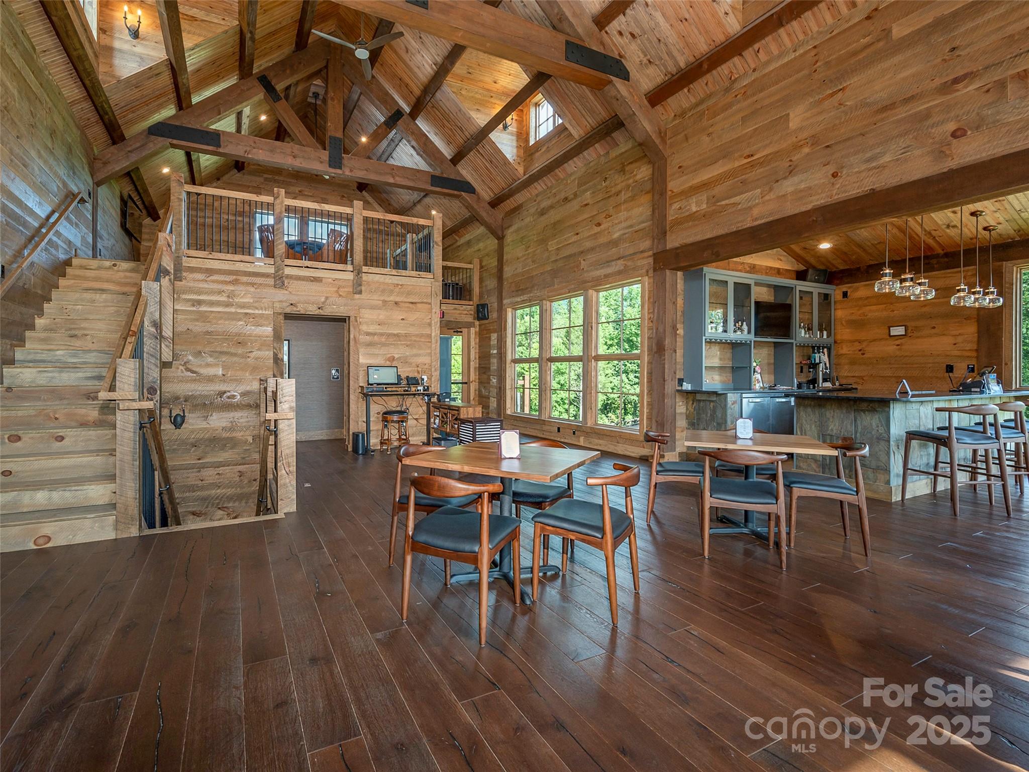 0 Deep Gap Rd Mill Spring East, Unit 97 Mill Spring, NC 28756 - Photo 22 of 22 a dining room with wooden floor a table and chairs