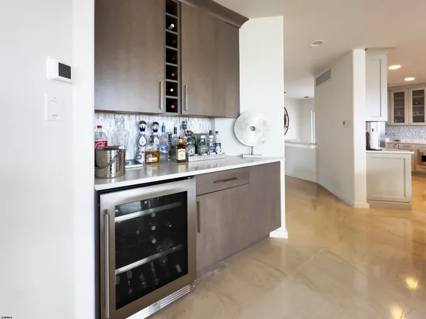 a kitchen with stainless steel appliances a sink stove and cabinets