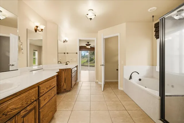 a view of an empty room with wooden floor and closet