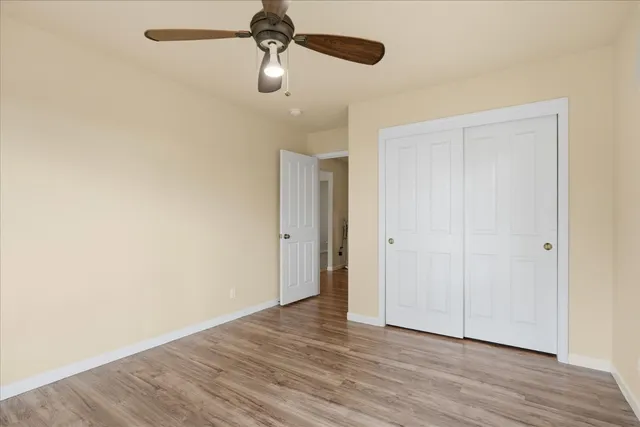 a bathroom with a sink a mirror a toilet and a shower