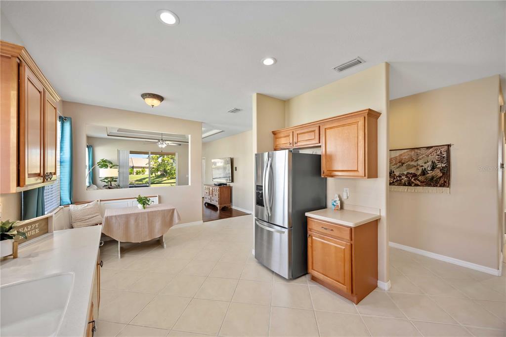 8769 Monterey Bay Loop Bradenton, FL 34212 - Photo 15 of 64 a large living room with stainless steel appliances furniture a rug and a large window