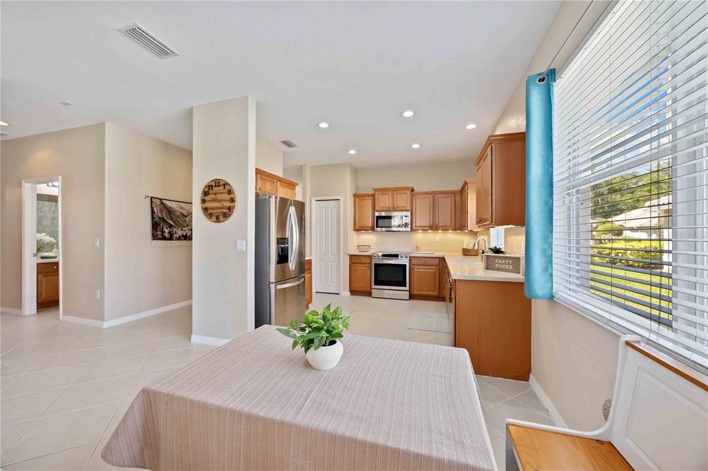 8769 Monterey Bay Loop Bradenton, FL 34212 - Photo 18 of 64 a living room with stainless steel appliances kitchen island granite countertop furniture and a kitchen view