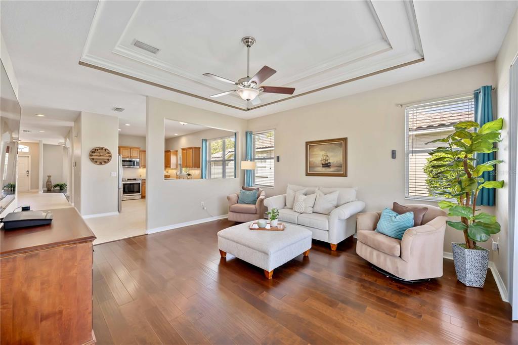 8769 Monterey Bay Loop Bradenton, FL 34212 - Photo 21 of 64 a living room with furniture and a wooden floor