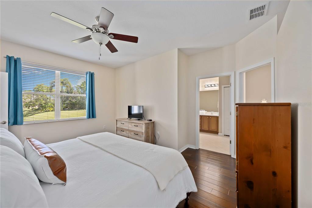 8769 Monterey Bay Loop Bradenton, FL 34212 - Photo 24 of 64 a bedroom with a bed and a window