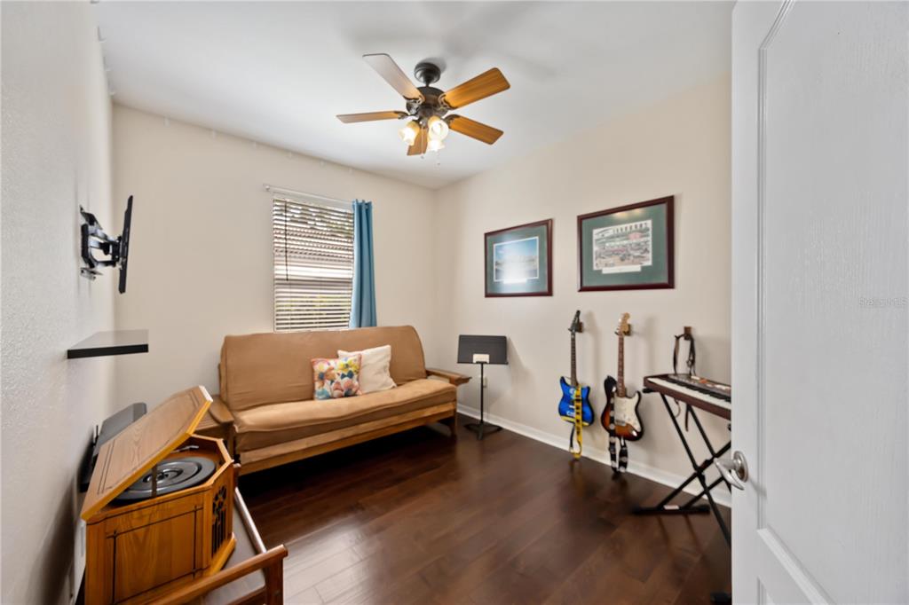 8769 Monterey Bay Loop Bradenton, FL 34212 - Photo 33 of 64 a living room with furniture and a wooden floor