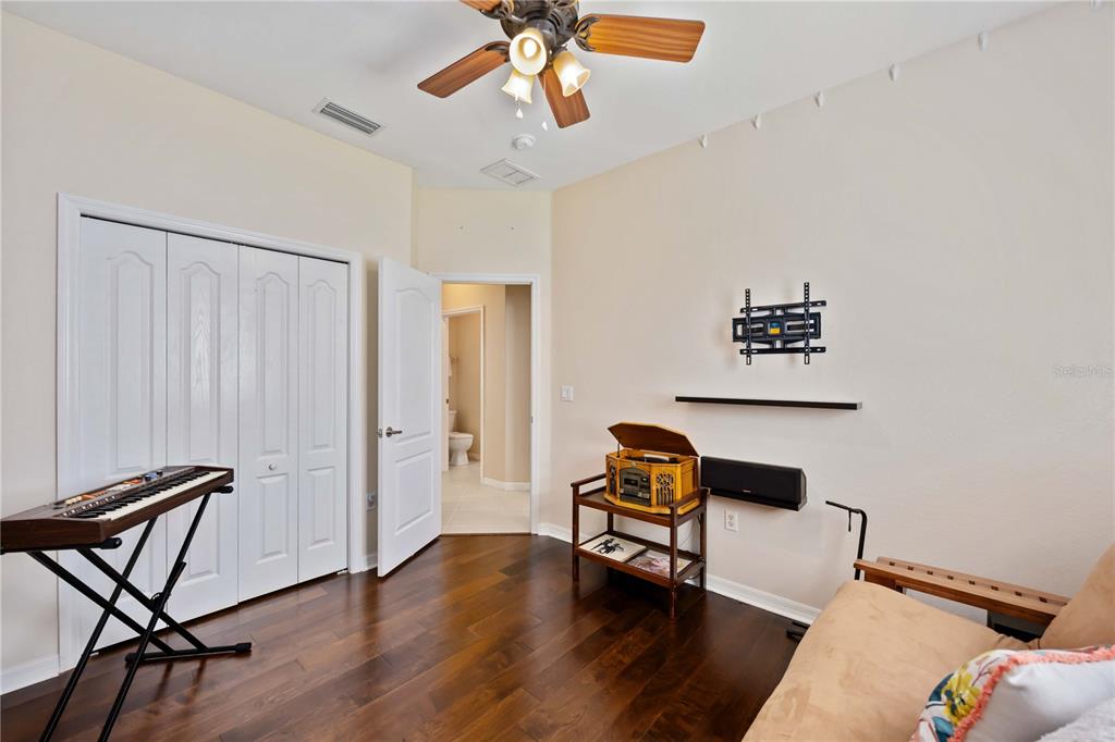 8769 Monterey Bay Loop Bradenton, FL 34212 - Photo 34 of 64 a living room with furniture and a wooden floor