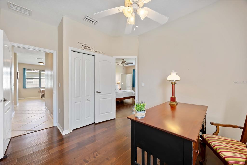 8769 Monterey Bay Loop Bradenton, FL 34212 - Photo 35 of 64 a view of a dining room with furniture and wooden floor