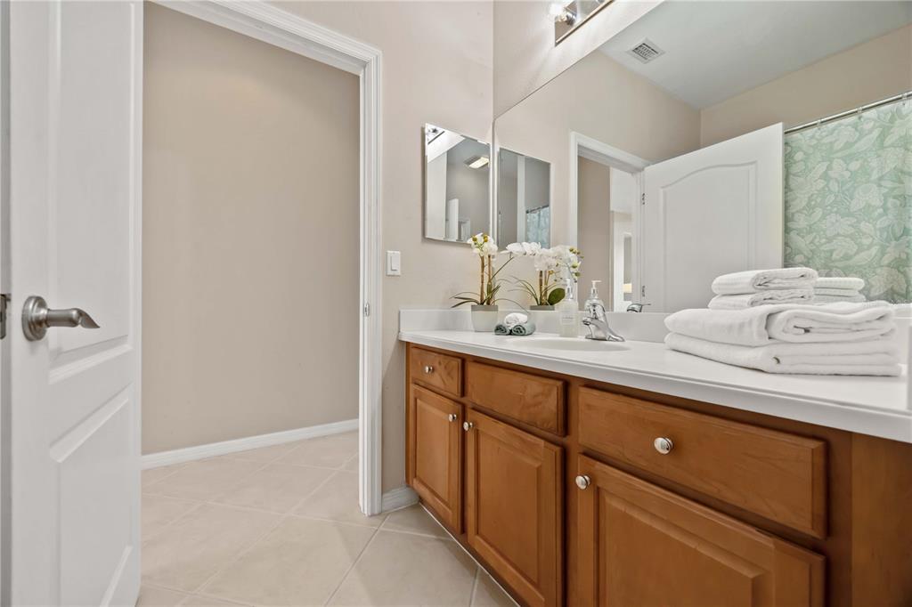 8769 Monterey Bay Loop Bradenton, FL 34212 - Photo 37 of 64 a bathroom with a granite countertop sink and a mirror