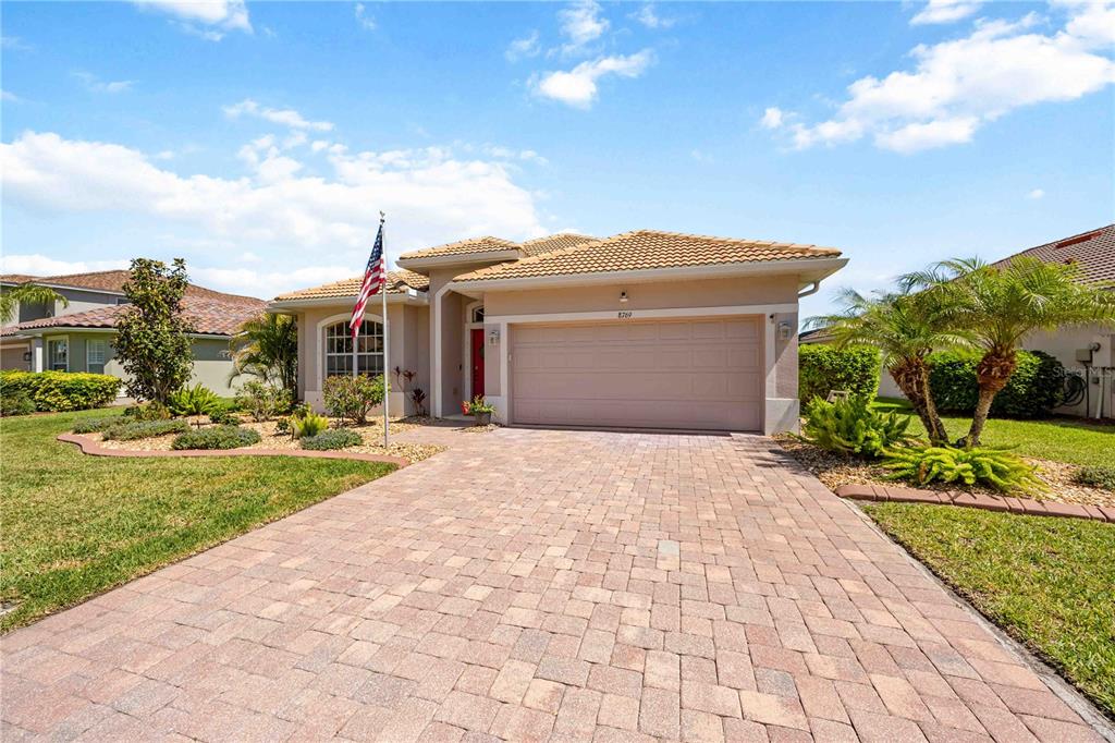 8769 Monterey Bay Loop Bradenton, FL 34212 - Photo 44 of 64 a front view of house with yard and green space