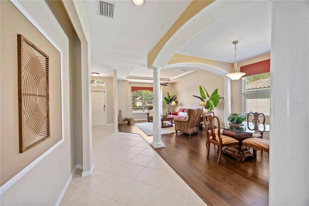8769 Monterey Bay Loop Bradenton, FL 34212 - Photo 6 of 64 a living room with furniture or couch and a chandelier