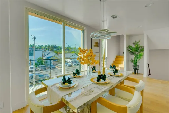 a view of a dining room with furniture window and outside view