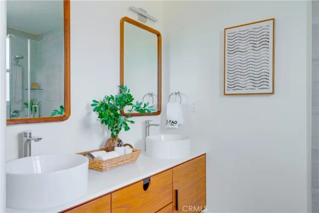 a bathroom with a sink a vanity and a mirror
