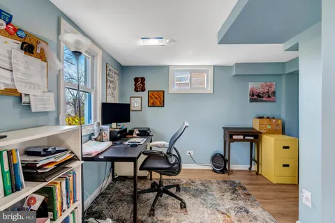 a view of a workspace with furniture