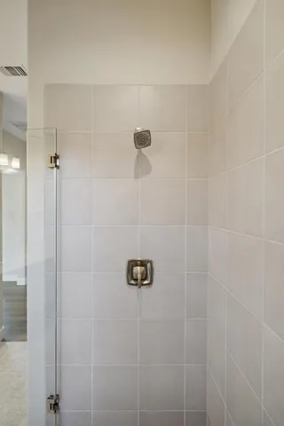 a bathroom with double vanity sinks and a mirror