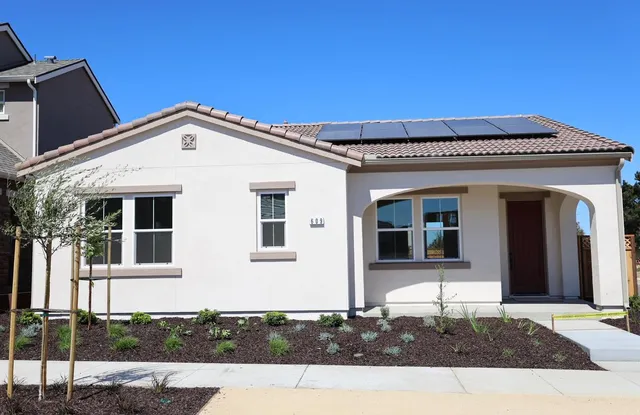 a front view of a house with a porch