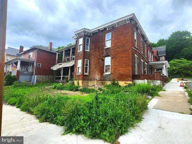 a view of a building next to a big yard