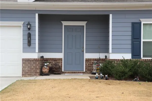 a front view of a house with a yard