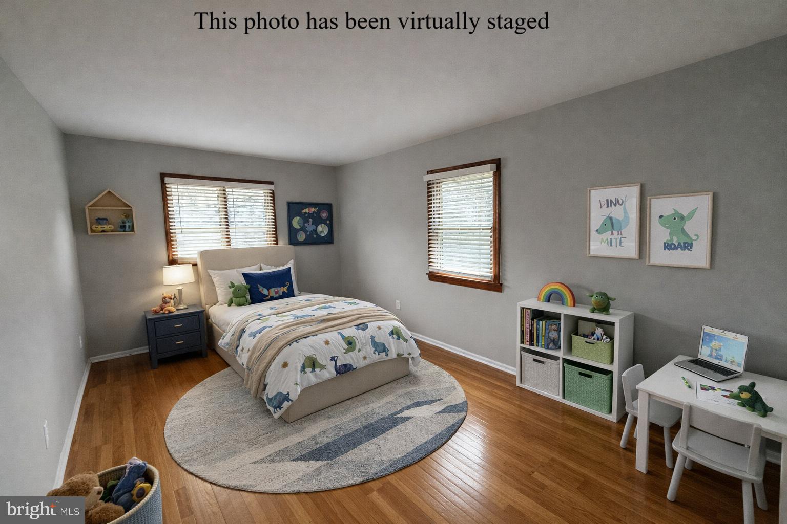 745 Windsor Place Wallingford, PA 19086 - Photo 23 of 33 a bedroom with a bed and wooden floor