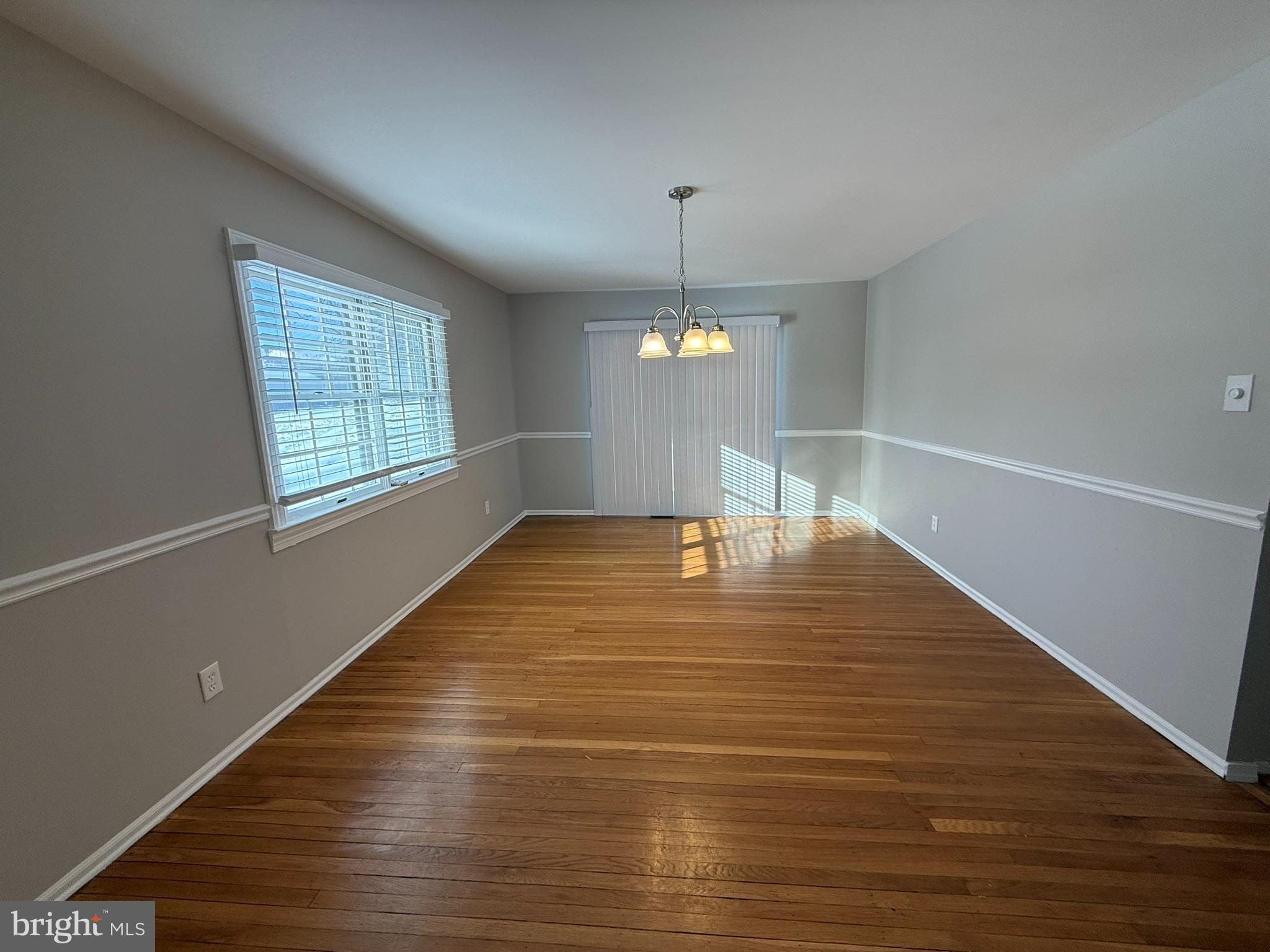 745 Windsor Place Wallingford, PA 19086 - Photo 5 of 33 a view of empty room with wooden floor and fan