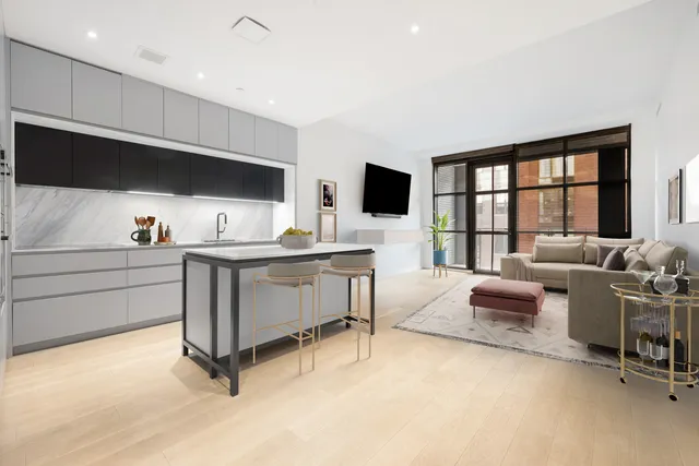 a living room with furniture a flat screen tv and a large window