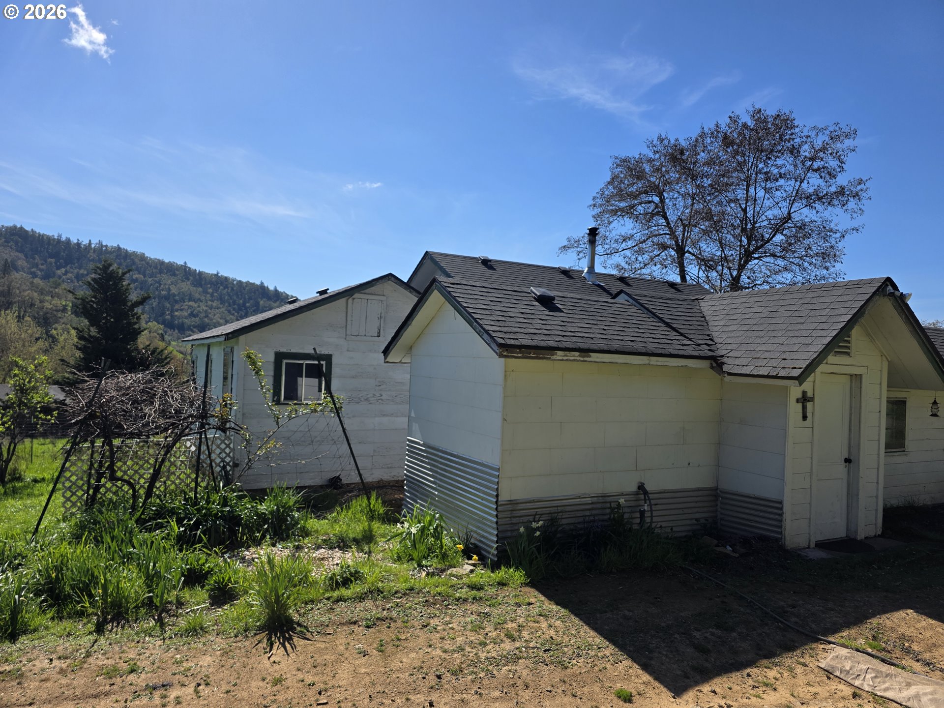 4341 Happy Valley Road Roseburg, OR 97471 - Photo 3 of 18 a house view with a garden space