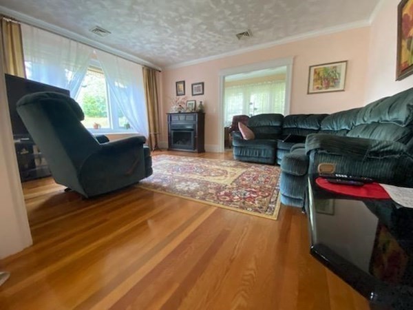 23 Colonial Road Worcester, MA 01602 - Photo 13 of 14 a living room with furniture and a window