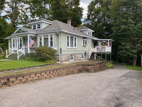 23 Colonial Road Worcester, MA 01602 - Photo 2 of 14 a front view of a house with a yard and garage