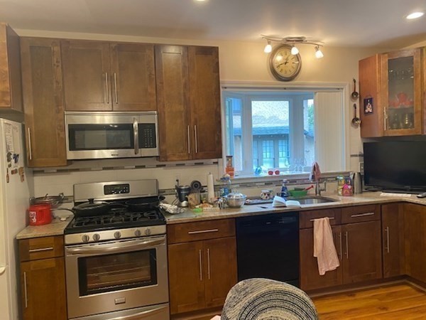 23 Colonial Road Worcester, MA 01602 - Photo 8 of 14 a kitchen with a sink and a stove top oven