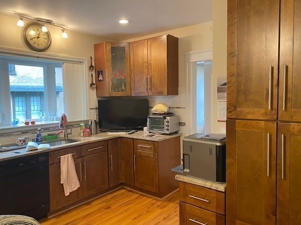 23 Colonial Road Worcester, MA 01602 - Photo 9 of 14 a kitchen with stainless steel appliances granite countertop a sink stove and refrigerator