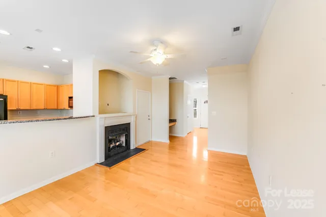 a bedroom with a bed and a view of kitchen