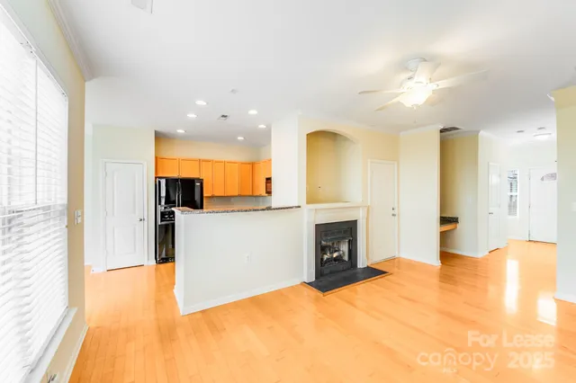 a kitchen with stainless steel appliances granite countertop a stove a refrigerator and a sink